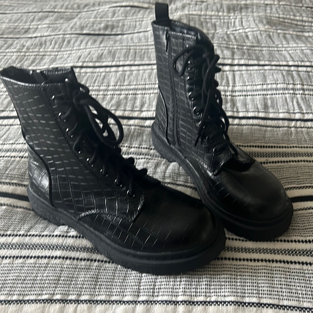 I am selling these soda black boots! They are size 10 never worn.